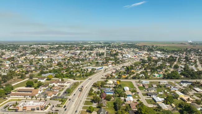 Belle Glade from the air, with the sugar fields running to the horizon