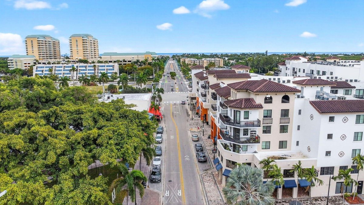 East Ocean Avenue in downtown Boynton Beach from the air, new buildings along the tree canopy