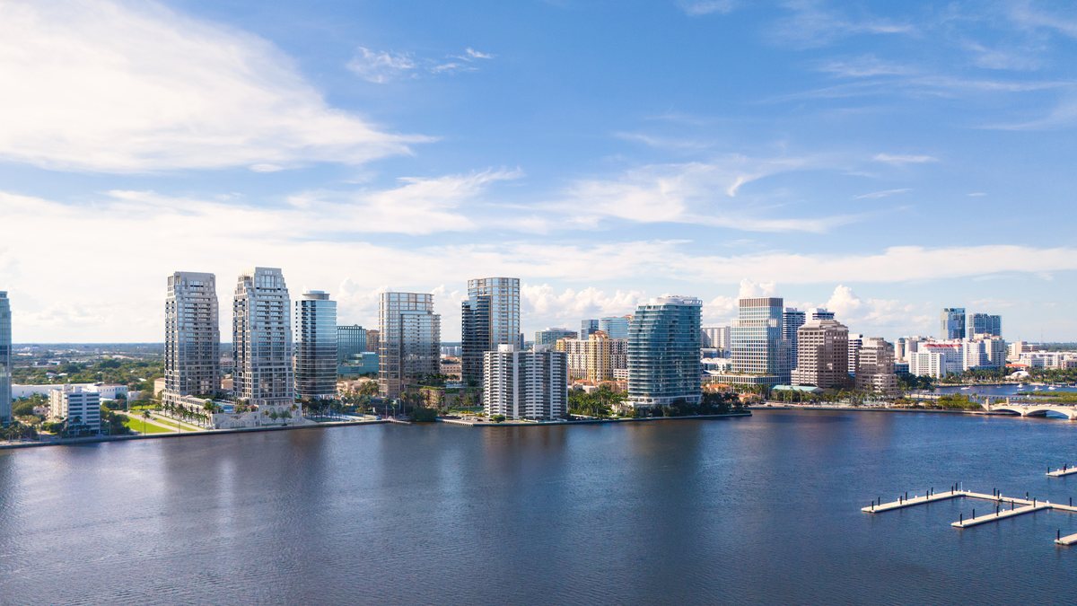The downtown West Palm Beach skyline across the Intracoastal, with boats at the docks